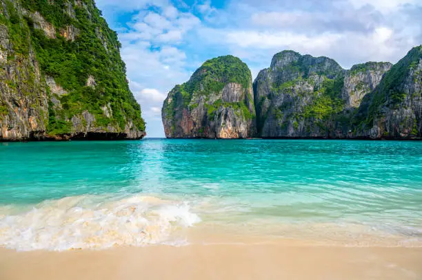 Photo of View of famous Maya Bay, Thailand. One of the most popular beach in the world. Ko Phi Phi islands. Beach without people.