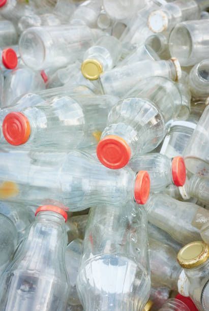 istock Used empty glass bottles stored for recycling, selective focus 1491260873