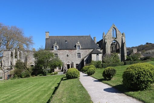 During spring holidays on April 20th 2023 at the abbey of Beauport in Brittany, France, people visit this famous monument where the km 0 to saint jaques de Compostelle pilgrimage is located
