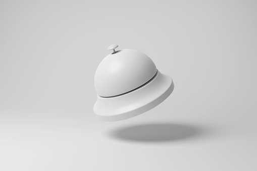 White service bell floating in mid air with shadow in monochrome. Illustration of the minimalist concept of restaurants and hospitality