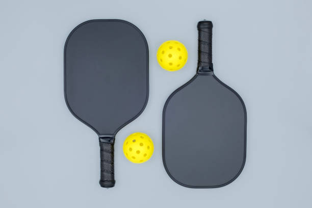 istock Pickleball paddles and balls on grey 1491270508