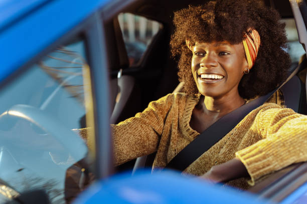 istock Cheerful female driver in the car 1491271093
