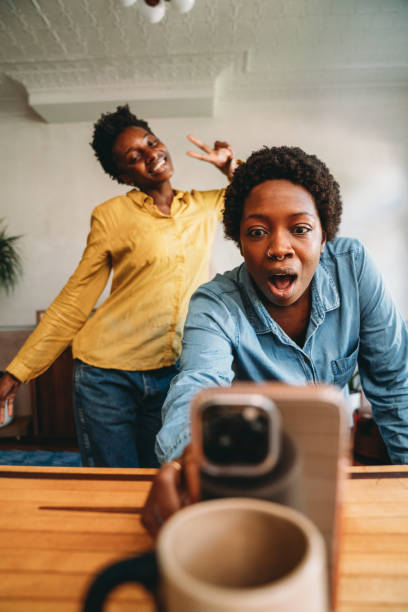 istock Two friends are dancing together at home while they are streaming with a smart phone 1491274302