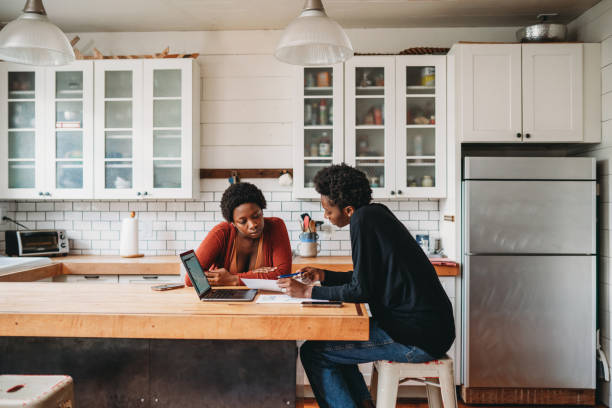 istock A financial advisor is explaining new strategies to a customer at home 1491274361