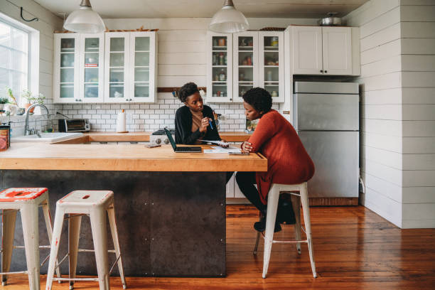 istock A financial advisor is explaining new strategies to a customer at home 1491274368