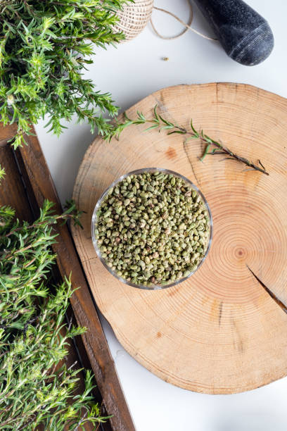 istock Bundle of fresh green aromatic thyme herbs with dried thyme seeds in a bowl. 1491280633
