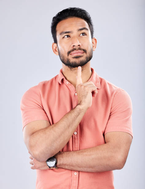 istock Thinking, idea and face of man on a white background with thoughtful, contemplating and wondering expression. Question mockup, studio and male pose with ideas, brainstorming and planning mindset 1491280977