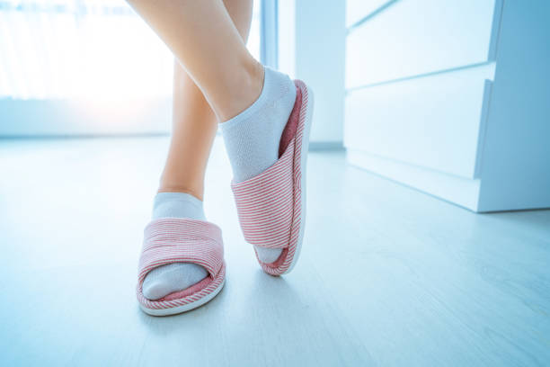 istock Female wearing home cozy soft comfortable slippers 1491281876