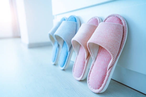 istock Home cozy soft female and male slippers 1491281879
