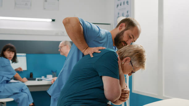 istock Male specialist doing orthopedic procedure with elder woman 1491283294