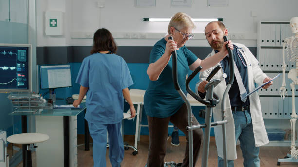 istock Senior patient doing muscle exercise on stationary bicycle 1491284287