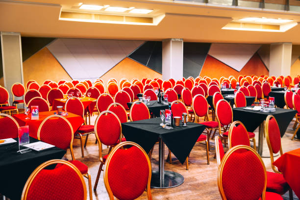 istock Rows of red chairs and tables in concert hall before the performance 1491284576