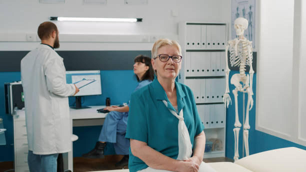 istock Portrait of old patient attending checkup visit exam with physician 1491284577