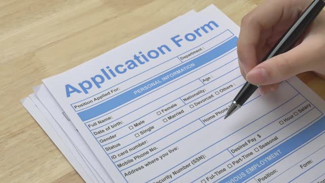 Checking the application form before filling in personal information.