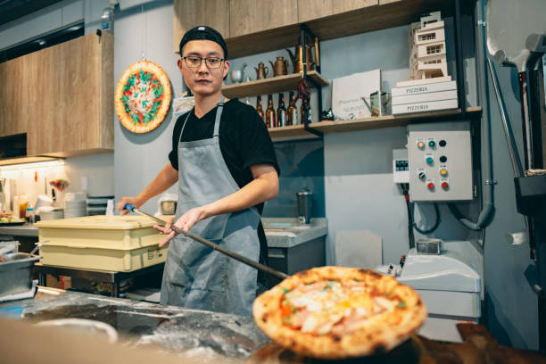 istock At the restaurant, a pizza chef is preparing pizza on the workstation. 1491289860