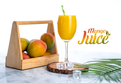 Fresh mango juice and mango fruit isolated on white background