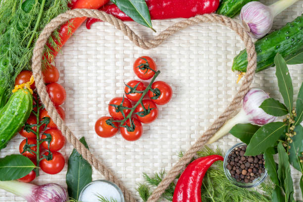 istock Composition on a light background of fresh organic vegetarian products: tomatoes, cherries, garlic, onions, cucumbers, lavrushka, pepper, dill. Top view, close-up. Healthy, healthy food. 1491290425