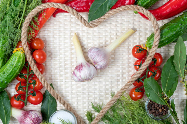 istock Composition on a light background of fresh organic vegetarian products: tomatoes, cherries, garlic, onions, cucumbers, lavrushka, pepper, dill. Top view, close-up. Healthy, healthy food. 1491290426