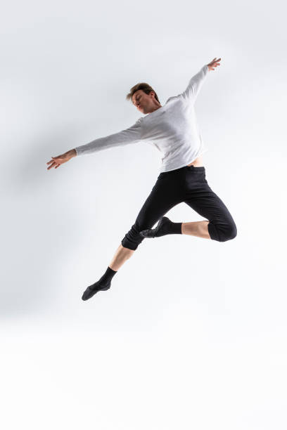 istock Athletic Modern Ballet Dancer. Contemporary Art Ballet With Young Flexible Athletic Man In Studio On White Background. 1491290457