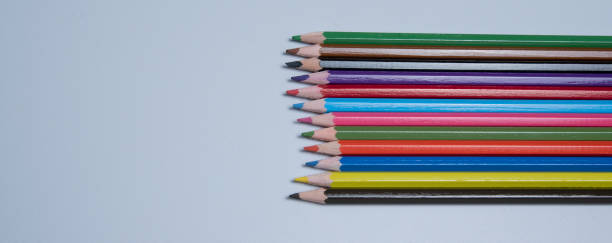 istock Colored pencils for drawing and coloring, on a white background. Figures made of colored pencils, school supplies 1491291360