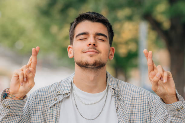 istock relaxed young man outdoors with sleepy or wishful expression 1491292288
