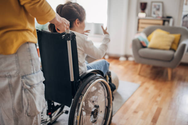 istock Mom with her disabled daughter 1491293387