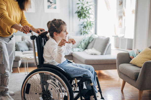 istock Mom with her disabled daughter 1491293503