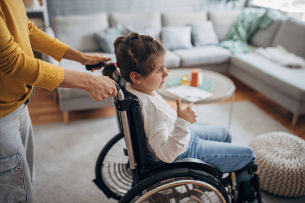 istock Woman with her disabled daughter 1491293958