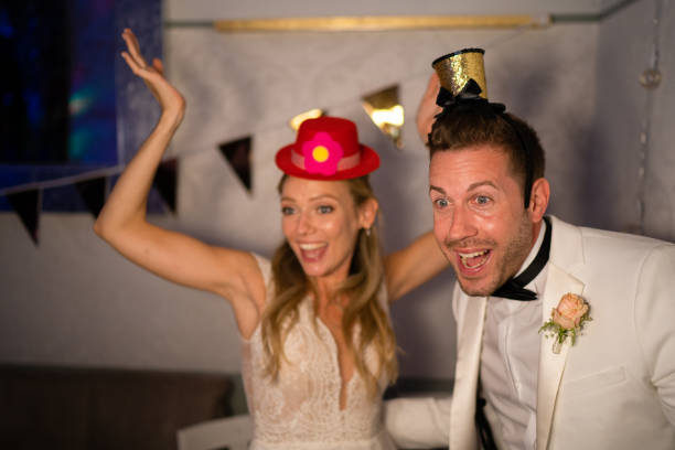 wedding couple having fun at party stock photo