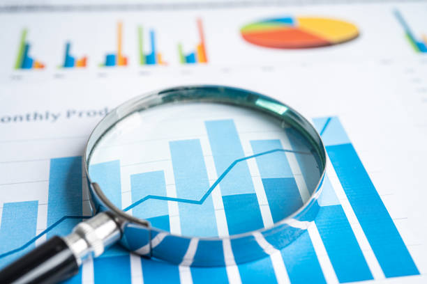 istock Magnifying glass on graph paper. Financial development, Banking Account, Statistics, Investment Analytic research data economy, Business concept. 1491297559