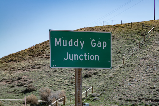 Highway sign for Muddy Gap Junction in central Wyoming in western USA of North America.