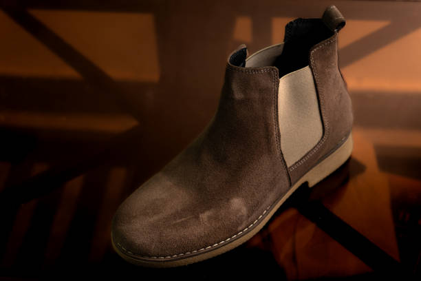 istock brown leather long shoes on reflective dark background 1491301564