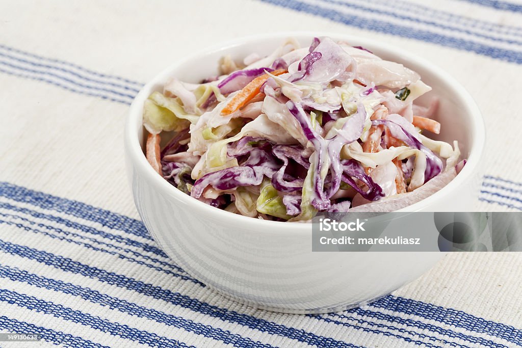 coleslaw side dish bowl of coleslaw salad - side dish on a tablecloth Coleslaw Stock Photo