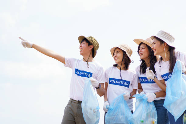 istock Group of volunteer collecting a garbage. 1491306565