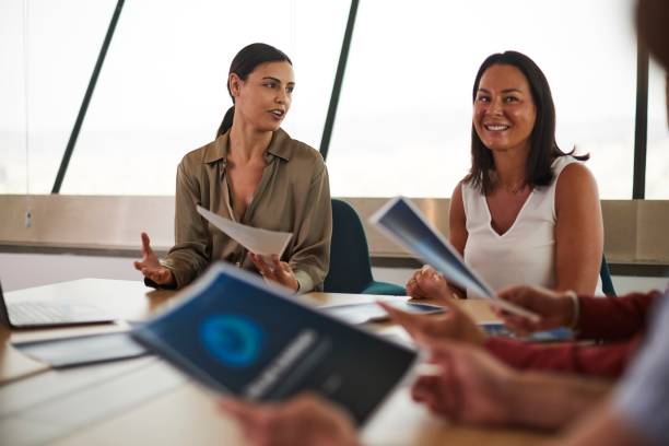 istock Collaborative Environment: Two Individuals Actively Engaged in Listening within a Dynamic Team Setting 1491306998