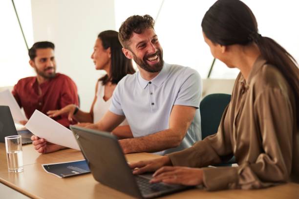 istock Prepping for Success: Vibrant Interactions at the Business Meeting's Onset 1491307217