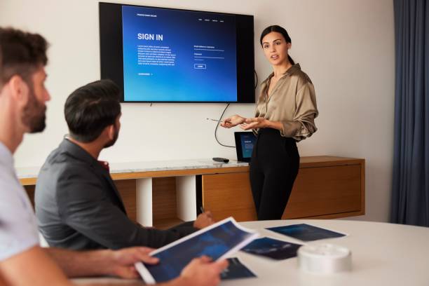 istock Innovative Web Design: Businesswoman Presents Mockup Login Page to Audience. 1491307300