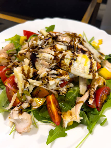 istock Salad with chicken breast, tomatoes, herbs and soy sauce 1491308409