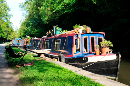 Barges and Narrow Boats on the Kennet and Avon Canal near Bath in Somerset England
