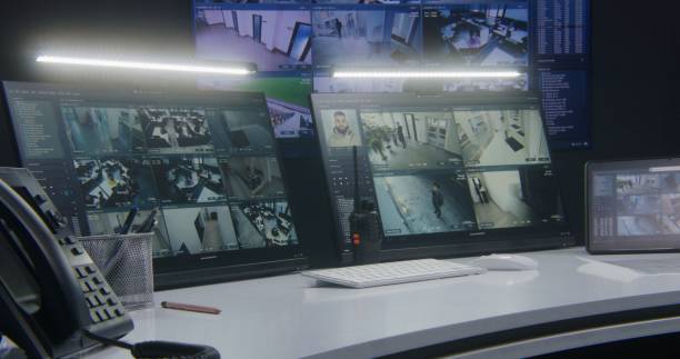 istock Computer monitors and tablet showing video footage of surveillance cameras 1491309831