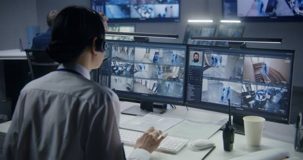 istock Female employee works in security control center 1491311472