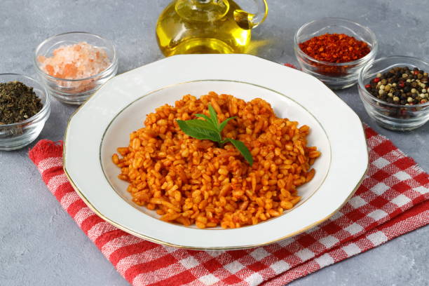 istock Traditional turkish bulgur pilaf with tomato sause in plate (Turkish name; meyhane pilavi) 1491313202