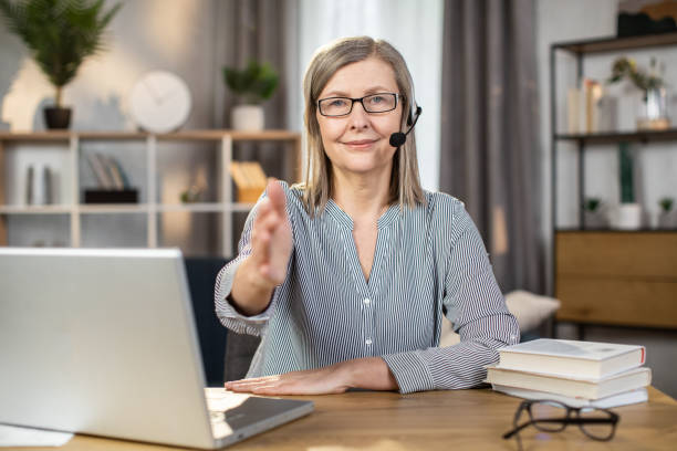 istock Consultant reaching hand out for shaking in remote workplace 1491313458