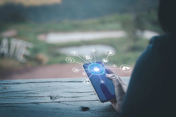 istock Business woman holding smart phone with network security icon. Protection network security computer and safe your data concept, cybersecurity and protection against dangers. Quality Assurance 1491314682