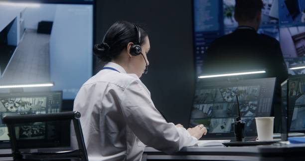 istock Female officer works on computer with CCTV cameras footage 1491314792