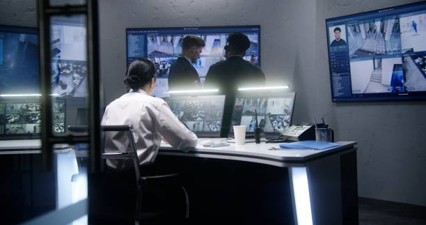 istock Multi ethnic employees talk in surveillance center 1491316513