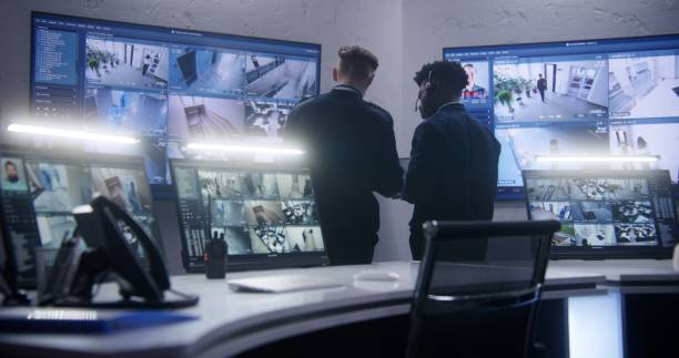 istock Multi ethnic employees talk in surveillance center 1491316808