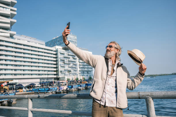 istock Senior man sightseeing downtown Toronto 1491317468