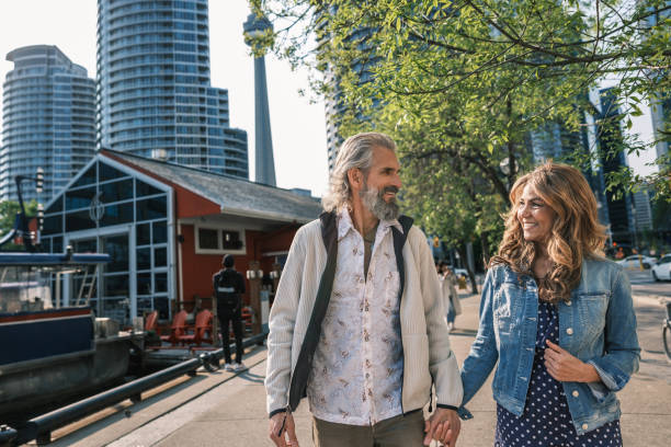 Senior mixed race Couple sightseeing downtown Toronto lake shore
