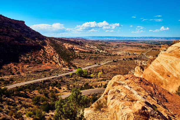 istock Roads carving through desert mountains with blue sky 1491319074